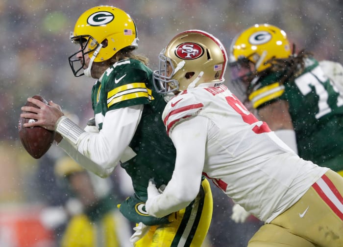 Arik Armstead of the San Francisco 49ers sacks the Green Bay Packers Aaron Rodgers
